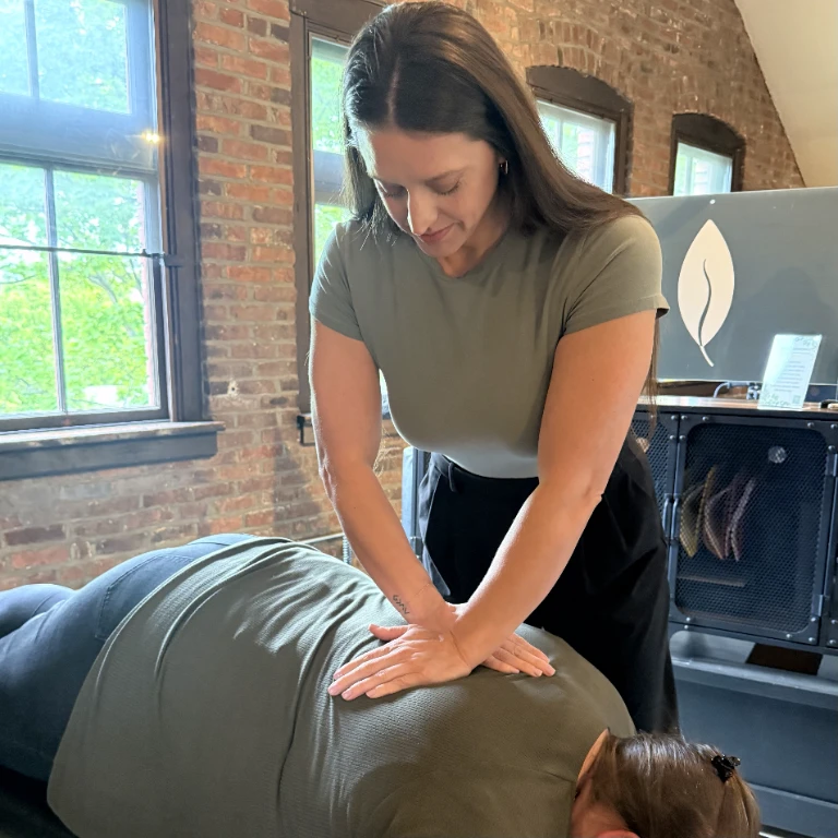 Dr. Lindsey Terronez providing hands-on chiropractic care